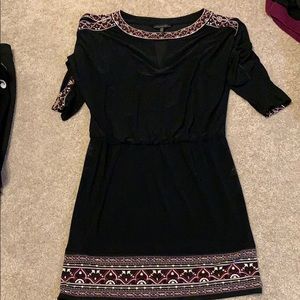 Black dress with detail on sleeves and hem